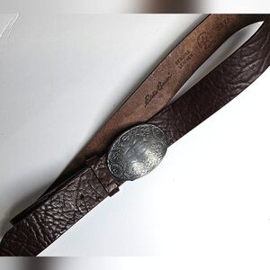 Brown Leather Belt with Intricate Silver Buckle